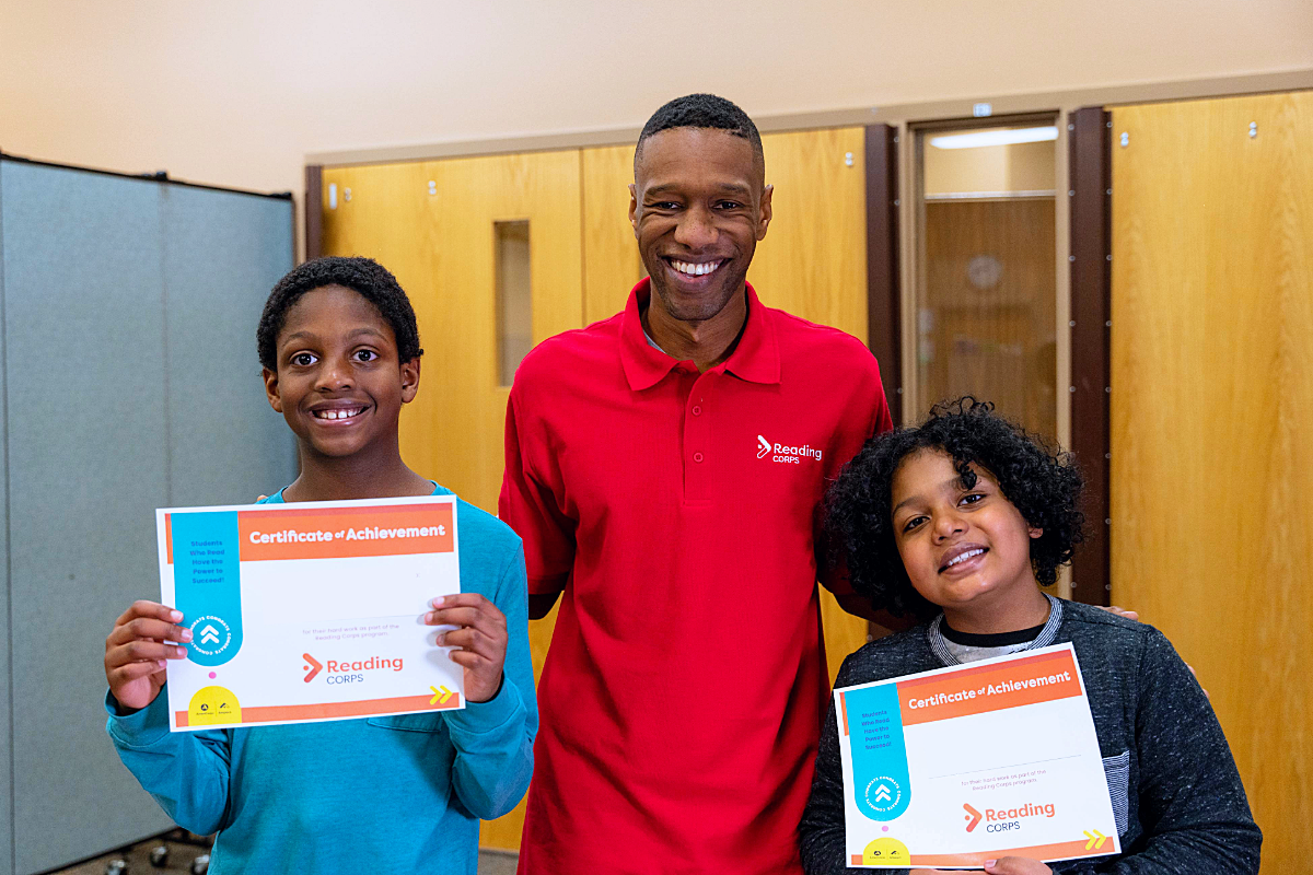 Two Reading Corps students with their tutor.