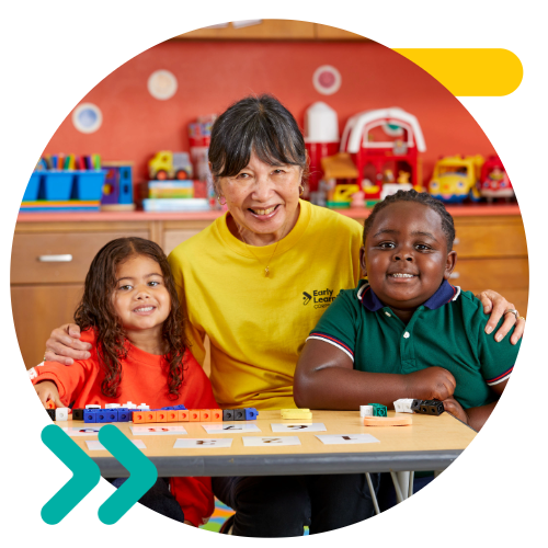 New York Early Learning tutor in a preschool classroom with learning and playing with students.